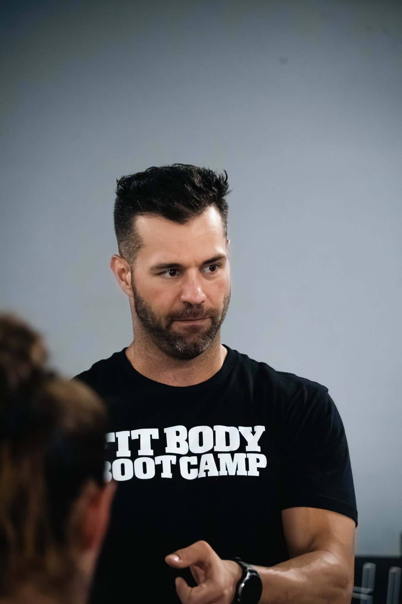 Fit Body Boot Camp Hyrox coach talking with athletes